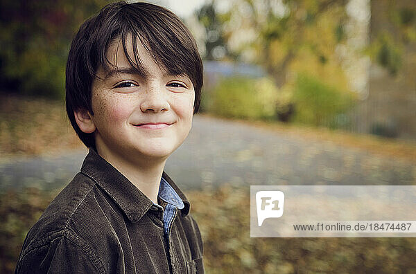 Cute boy smiling at park