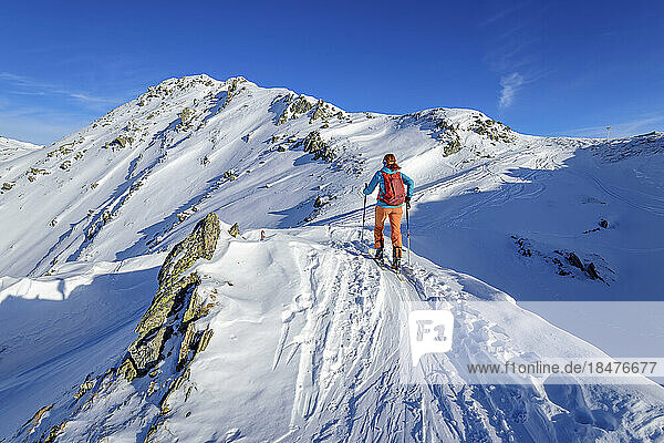Austria  Tyrol  Lone female skier in Tux Alps