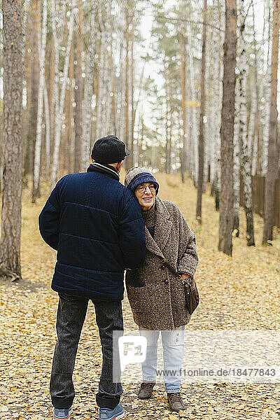 Elderly couple enjoying at autumn park