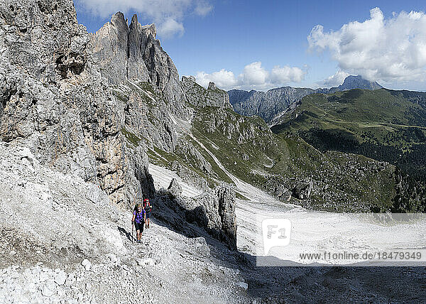 Senior woman hiking at Forcella Della Roa  Dolomites  Italy