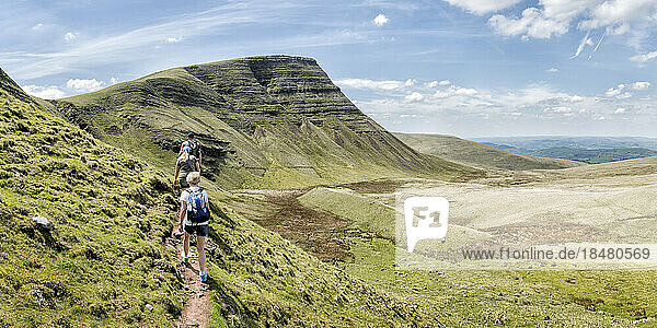 Man and women hiking at mountain  Brecon Beacons  Wales