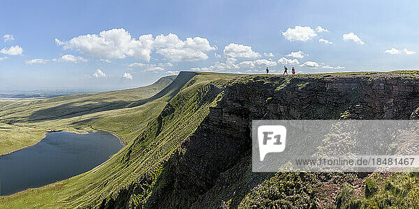 Man and women walking at Fan Brycheiniog on sunny day  Brecon Beacons  Wales