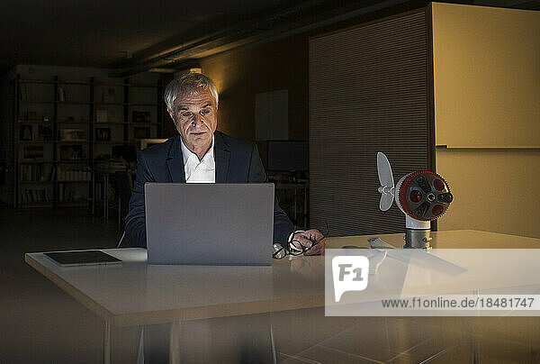 Businessman working on laptop at office