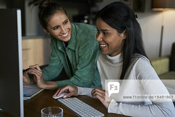 Happy freelancers working together at home office