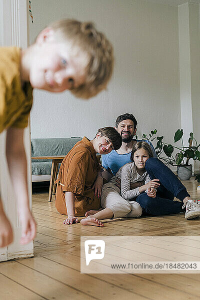 Happy family spending leisure time in living room at home