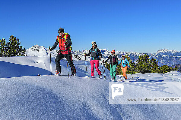 Austria  Tyrol  Group of skiers traveling in row across Grosser Galtenberg