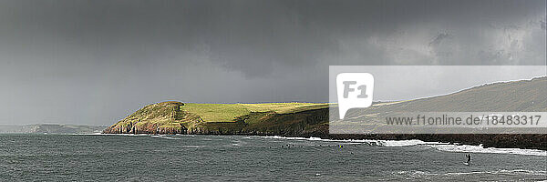 Scenic view of storm clouds over sea  Manorbier Beach  Pembrokeshire  Wales