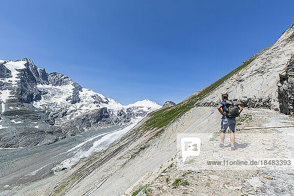 Austria  Carinthia  Male hiker admiring view of Pasterze glacier