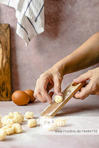 Hands of woman making gnocchi