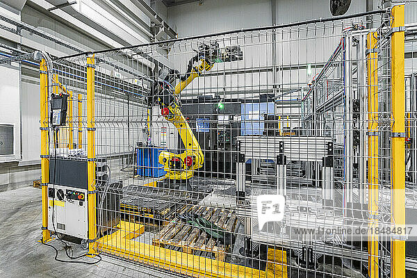 Robotic arm with machinery in industry