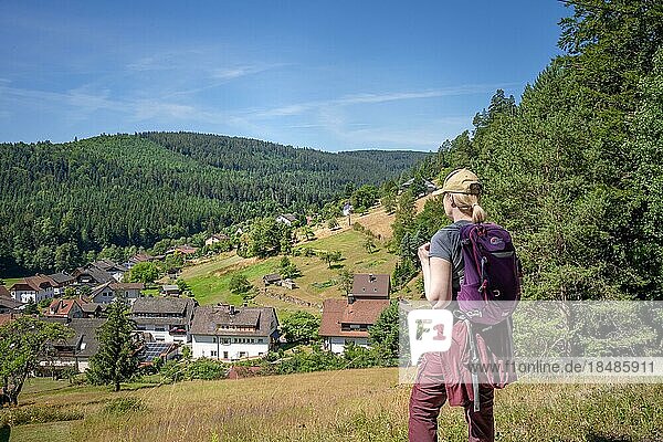 Woman looking into the landscape on the hiking trail Sprollenhäuser Hut  Bad Wildbad  Black Forest  Germany  Europe