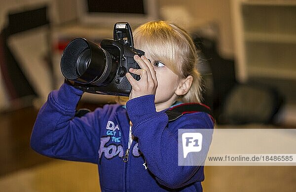 Girl (6) with reflex camera  Kiel  Germany  Europe
