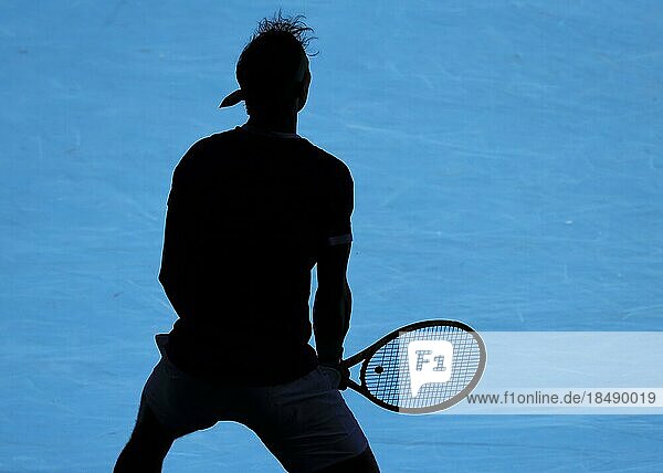 Silhouette of Spanish tennis player Rafael Nadal waiting to serve during the Australian Open 2022 tennis tournament  Melbourne Park  Melbourne  Victoria  Australia.
