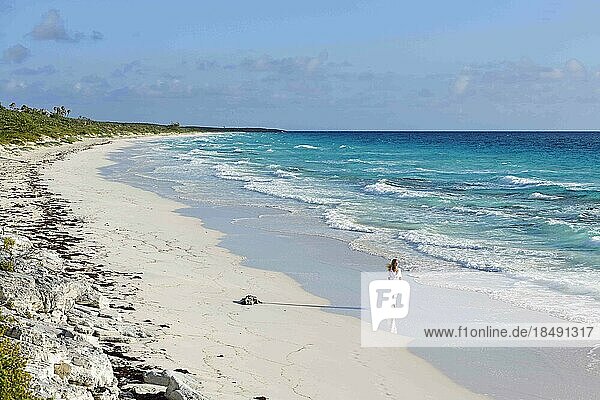 Tourist on the beach of Highbourne Cay  Exuma Cays  Bahamas  Central America
