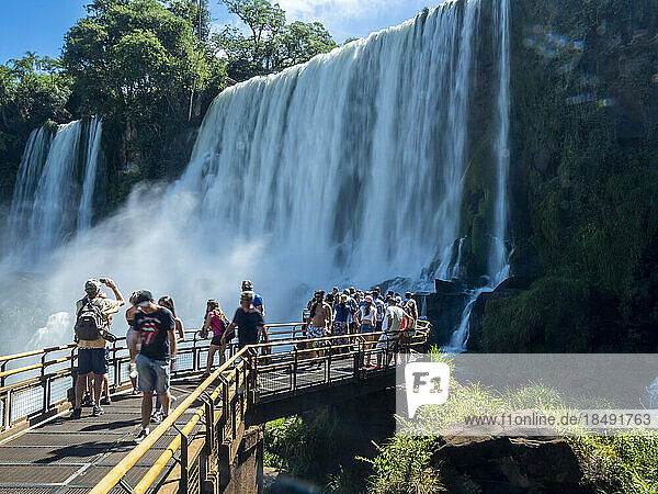 Tourists on a platform on the lower circuit at Iguazu Falls  UNESCO World Heritage Site  Misiones Province  Argentina  South America