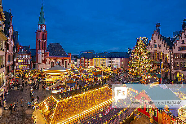 View of carousel and Christmas Market stalls at dusk  Roemerberg Square  Frankfurt am Main  Hesse  Germany  Europe