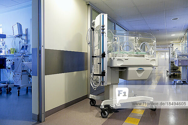 An incubator crib in a paediatric intensive care unit in a university hospital.