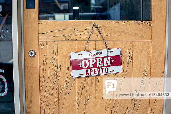 An Open sign on a restaurant door. -