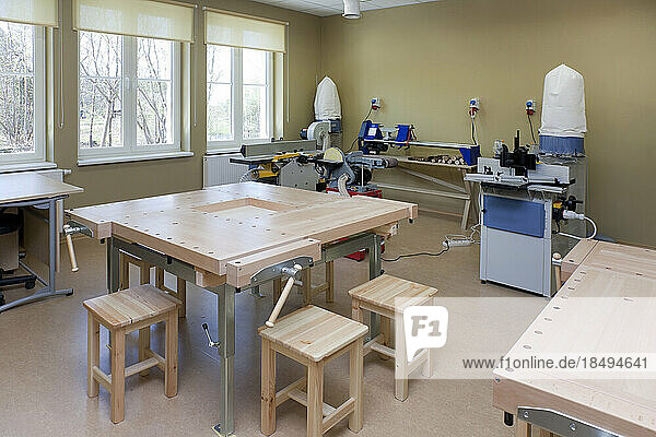 A school classroom with woodworking equipment  machinery and light engineering equipment  for vocational training.