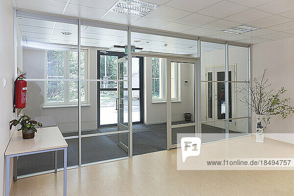 An empty modern school  wide glass doors and entrance hall.