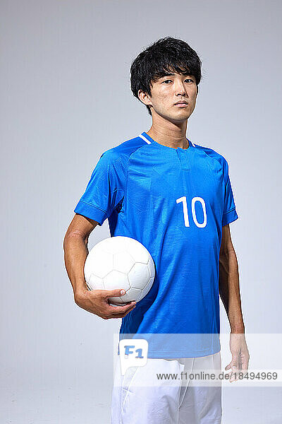 Soccer player studio portrait