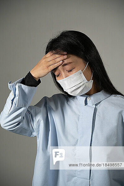 Young woman wearing protective mask