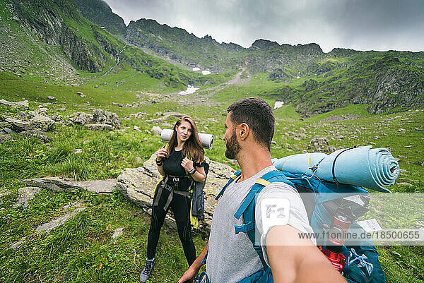 Couple Hiking in the Carpathian Mountains of Romania
