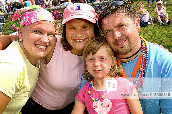 Twin sisters (left) pose with family members at the Komen Breast Cancer 3-Day walk in Detroit  Michigan.