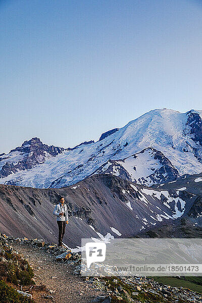 A Man With a Camera is Standing in Mt. Rainier National Park