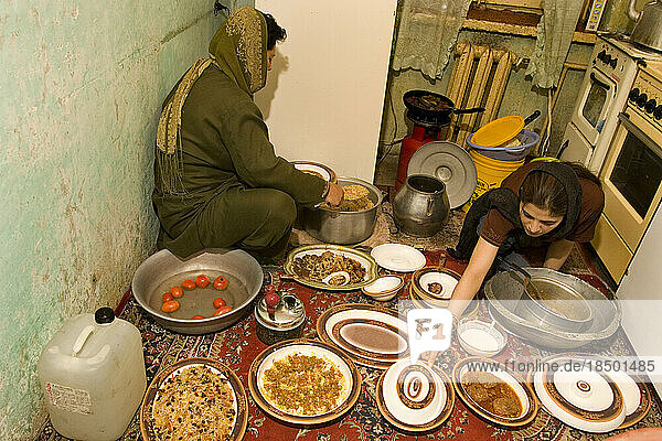 Women prepare an Afghan meal in their kitchen in Kabul.