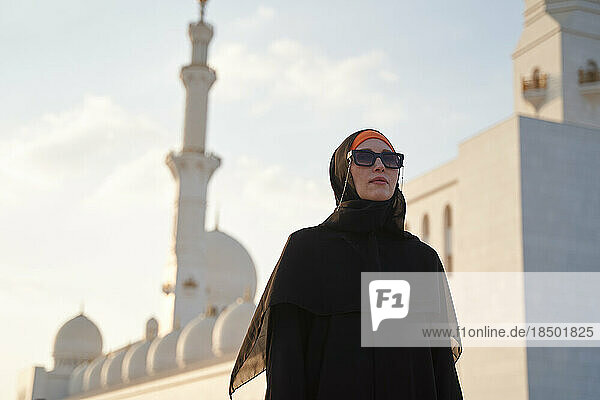 European woman is sightseeing in an Arab country in national clothes.