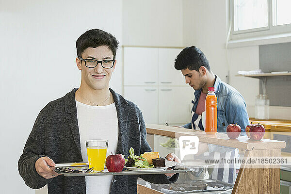 University student with his lunch in plate School  Bavaria  Germany