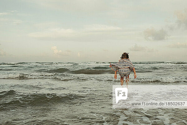 Girl Jumping in Waves at the Beach in Corpus Christi Texas