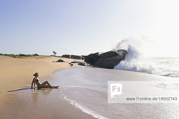 Woman relaxing on the beach  Western Province  Sri Lanka