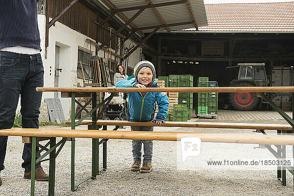 Boy playing around picnic table  Bavaria  Germany