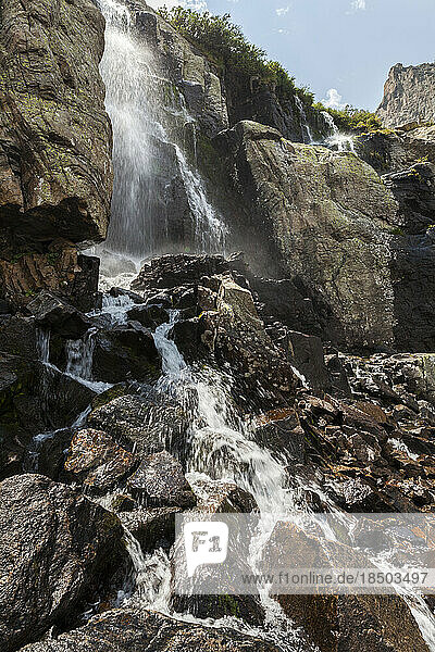 Waterfall tumbles over rocks in Rocky Mountain National Park