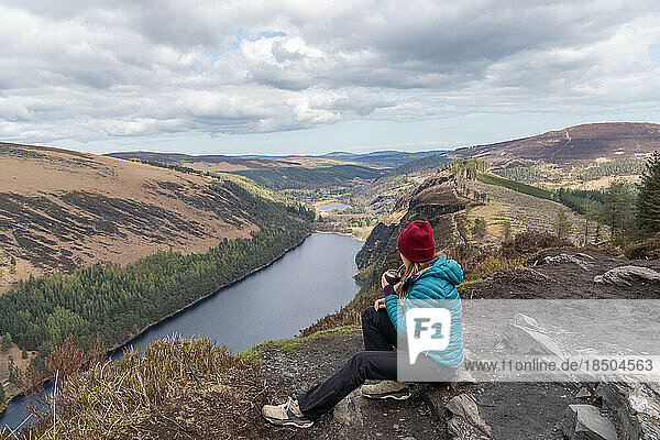 Hiker woman drinking traditional Argentinian mate in Glendalough