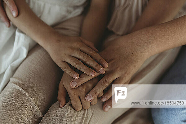 Close up of family's hands intertwined
