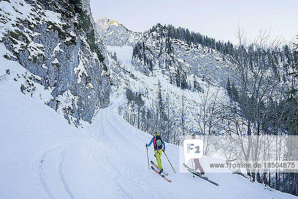 Men skiing on snow slope