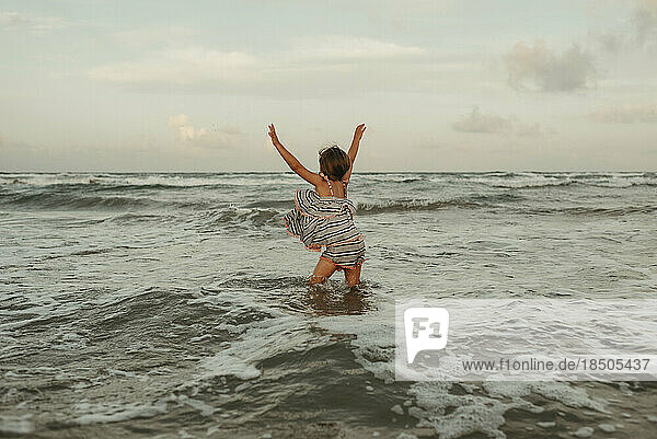 Little Girl Playing in Waves in Corpus Christi Texas