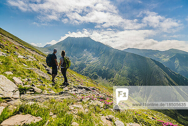 Couple Hiking in the Carpathian Mountains - Moldoveanu Peak
