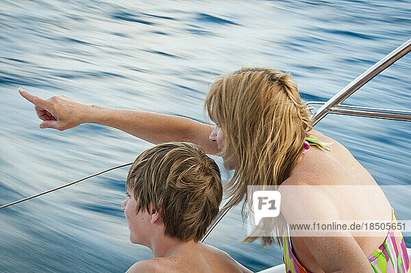 Mother and son on a boat.