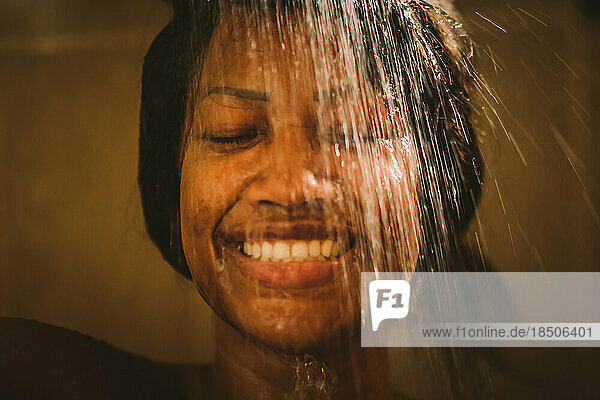 black sensual Woman in a shower under water