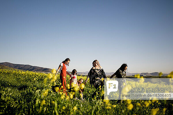 Mom  Daughters  Aunt & Uncle Walking in Flower Field in San Diego