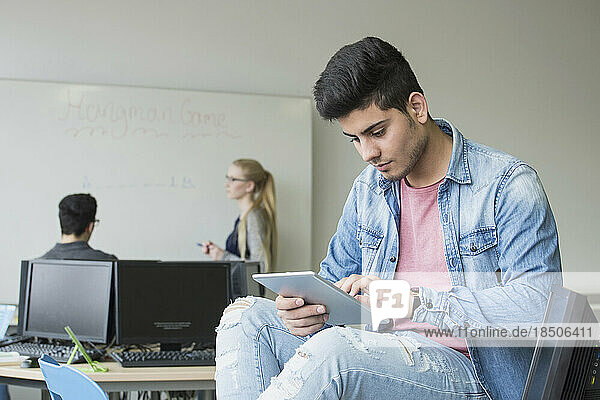 University student with digital tablet in classroom School  Bavaria  Germany