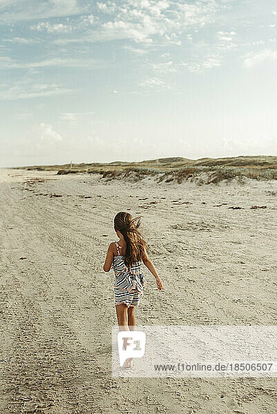 Little Girl Walking on beach in Corpus Christi Texas