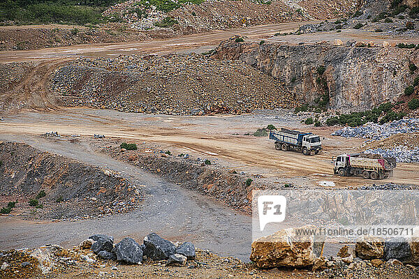 dumb trucks working at gravel mine in Thailand
