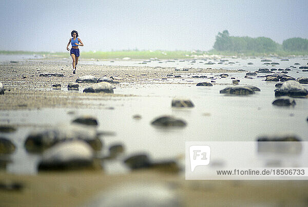 Woman Running on beach.