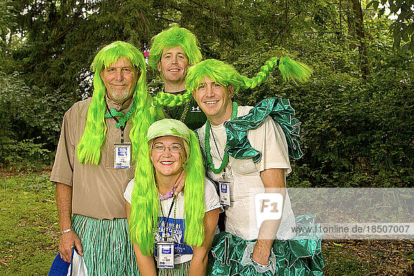 A family wears green wigs and costumes at a breast cancer walk in Washington DC.