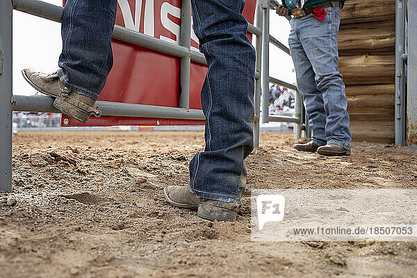Boots and spurs from a low angle at the Arizona black rodeo